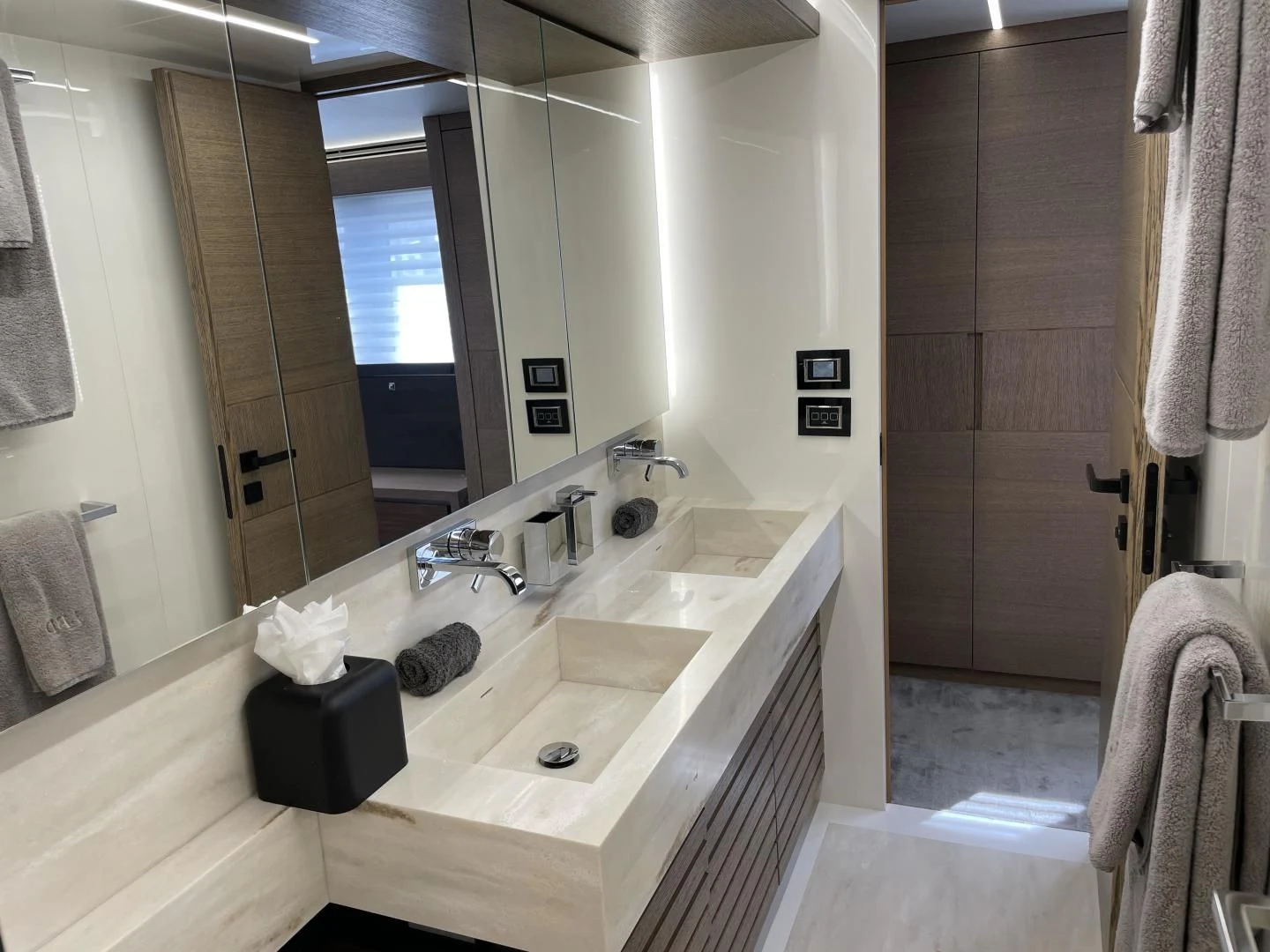 a bathroom with a sink and a mirror aboard LEBRADA Yacht for Sale