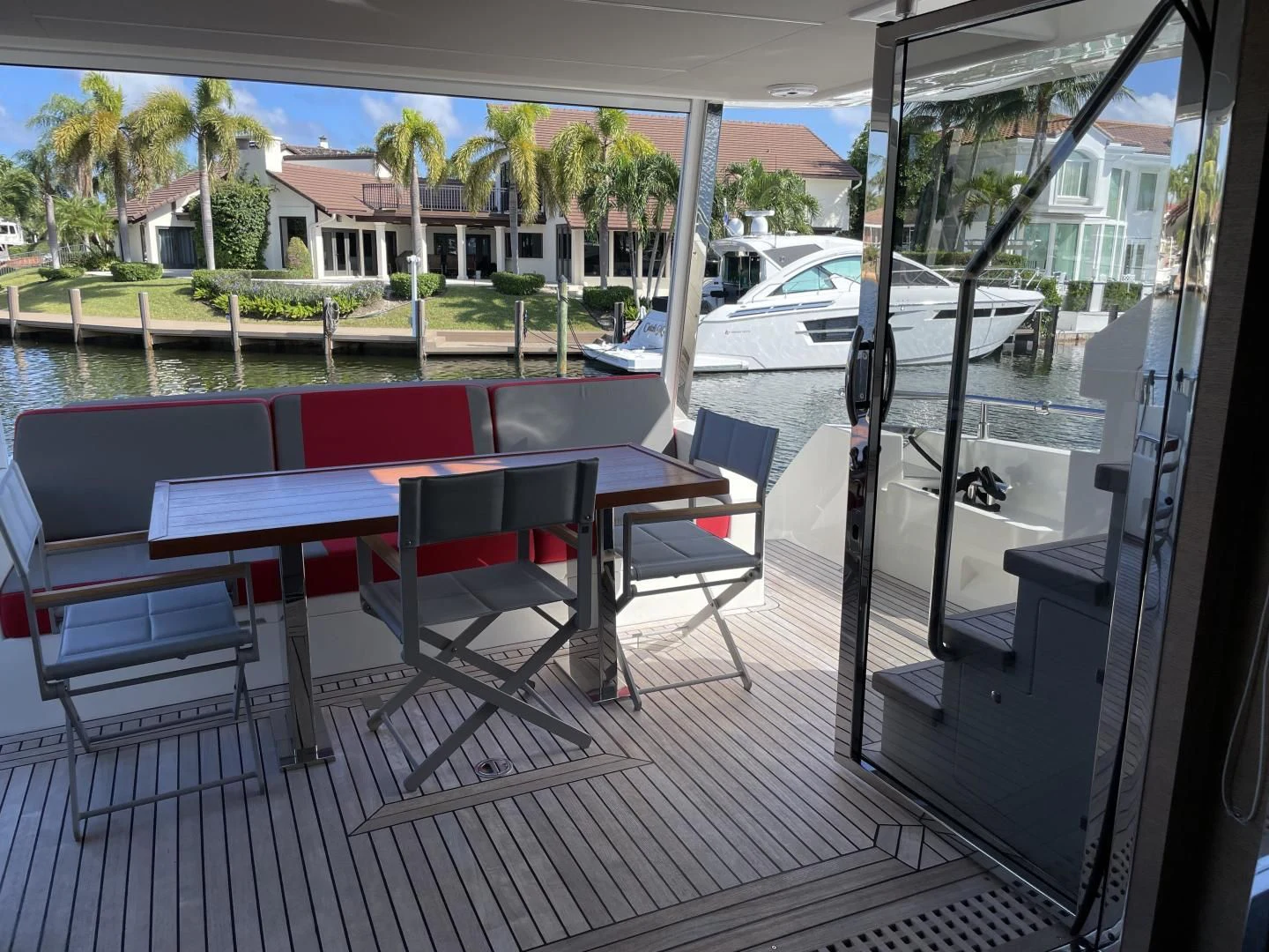 a table and chairs on a deck aboard LEBRADA Yacht for Sale