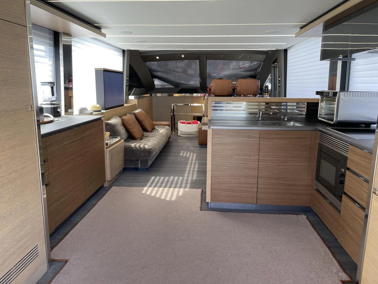 a large kitchen with a large island aboard LEBRADA Yacht for Sale