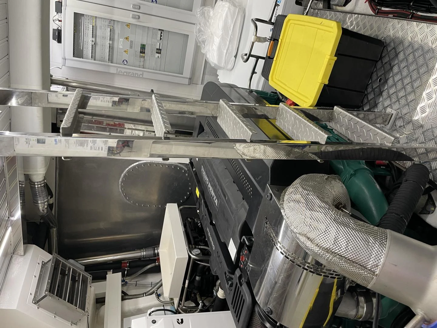 a room with a shelf of computer equipment and a chair aboard LEBRADA Yacht for Sale