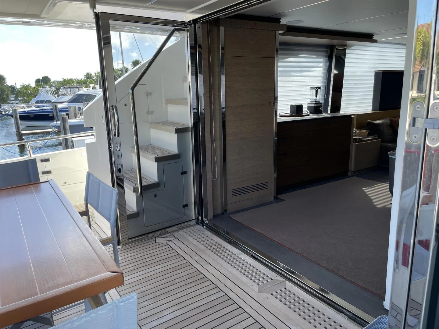 a room with a table and chairs aboard LEBRADA Yacht for Sale