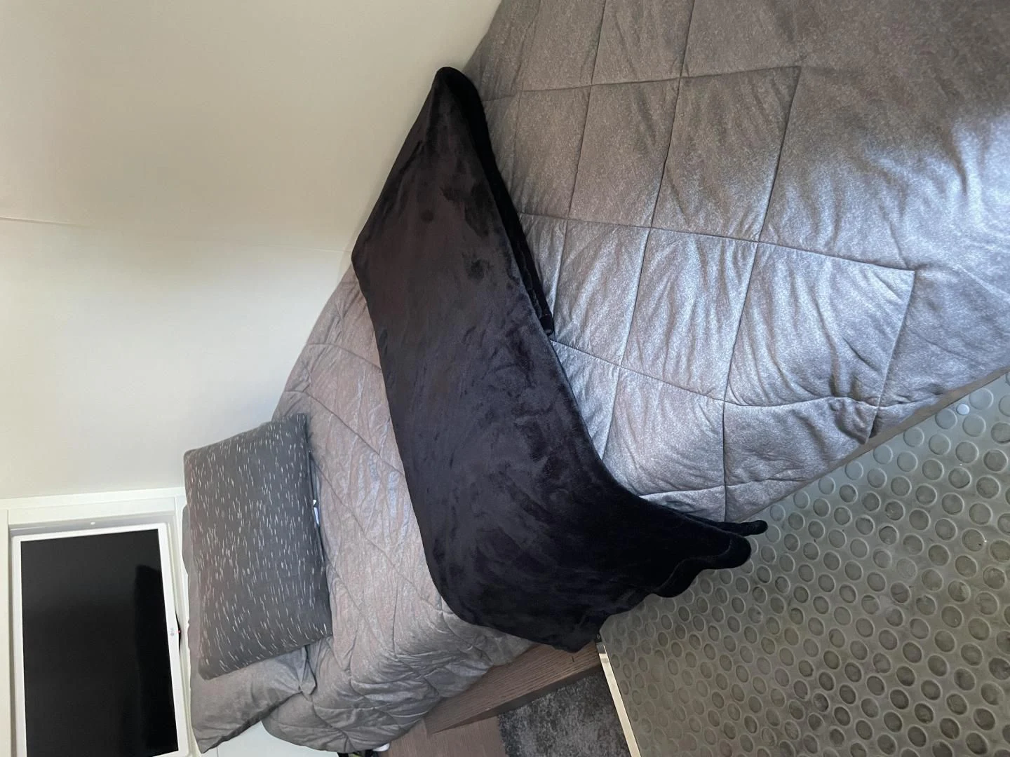 a black shoe on a couch aboard LEBRADA Yacht for Sale