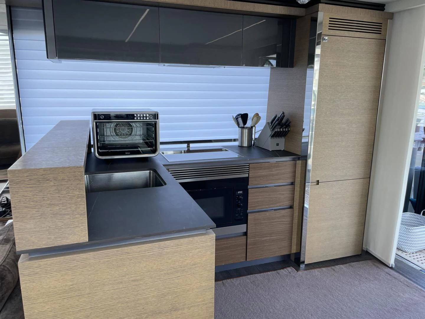 a kitchen with a stove and oven aboard LEBRADA Yacht for Sale