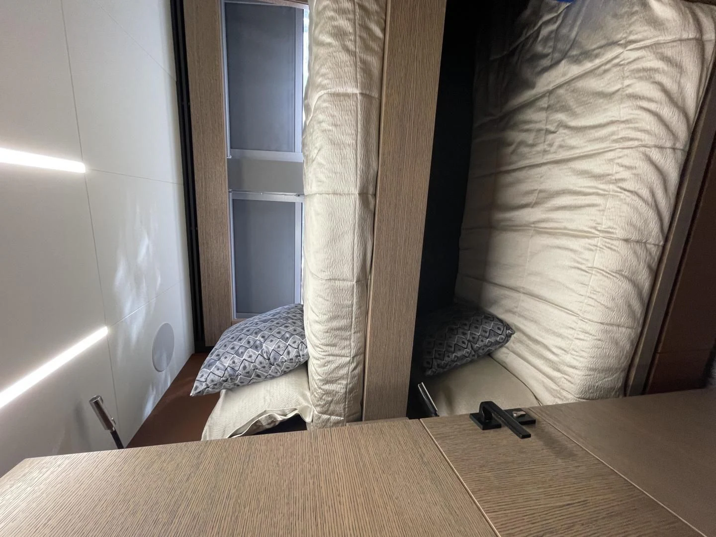 a cat lying on a bed aboard LEBRADA Yacht for Sale