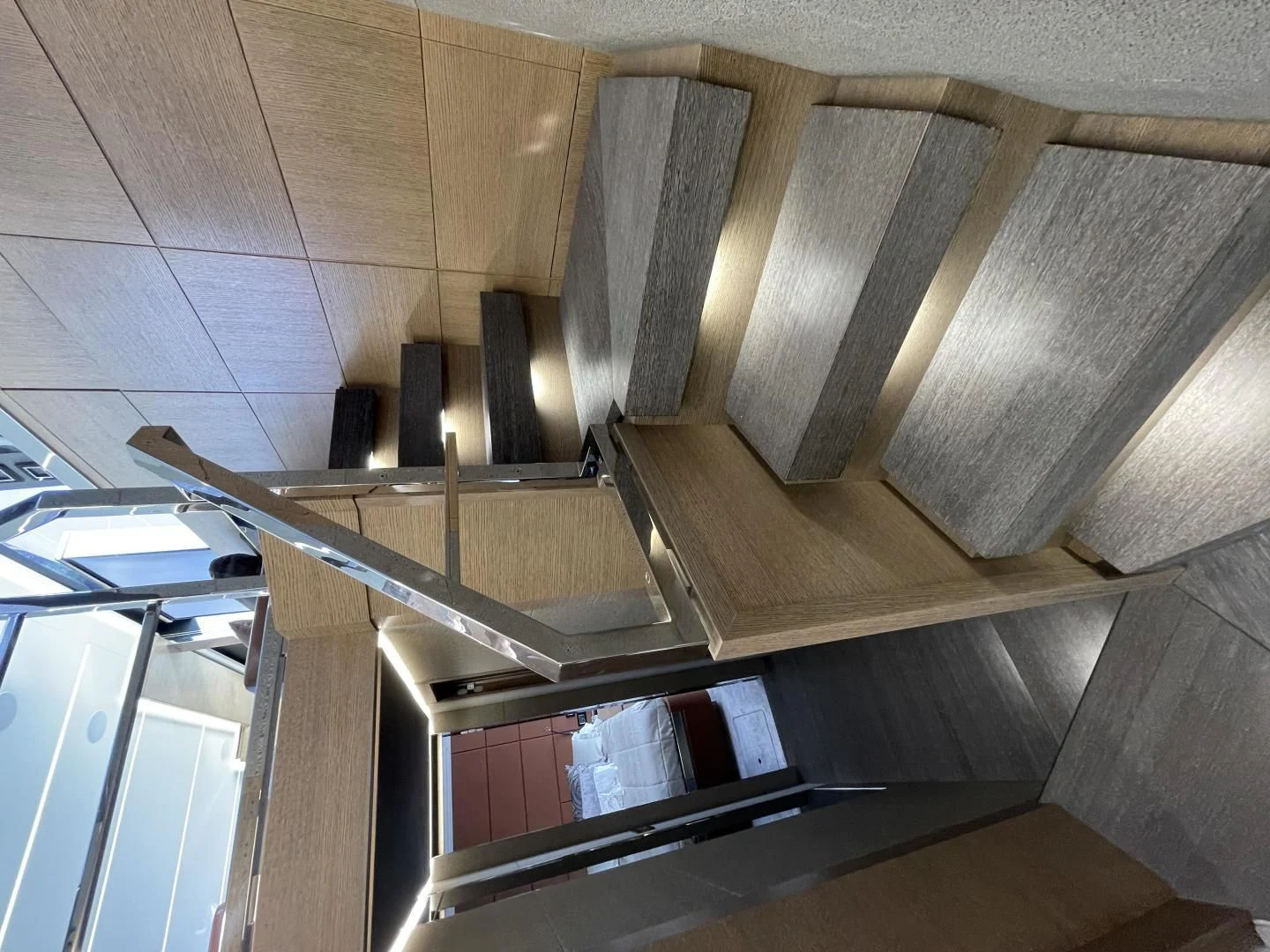 a staircase with a metal railing aboard LEBRADA Yacht for Sale
