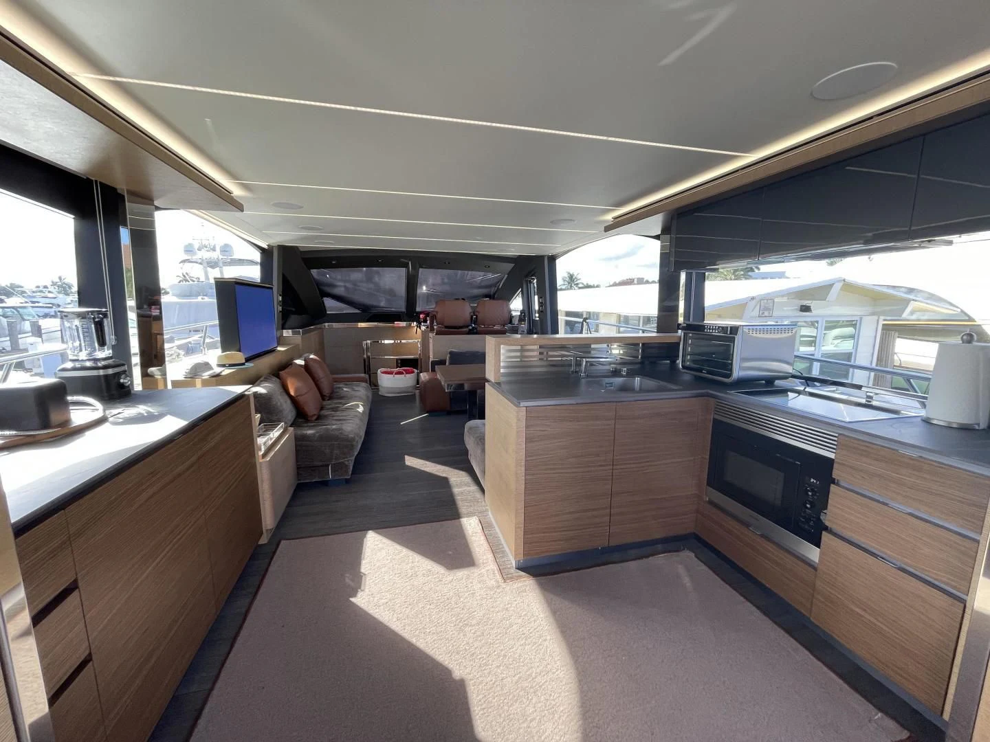 a large kitchen with a large window aboard LEBRADA Yacht for Sale