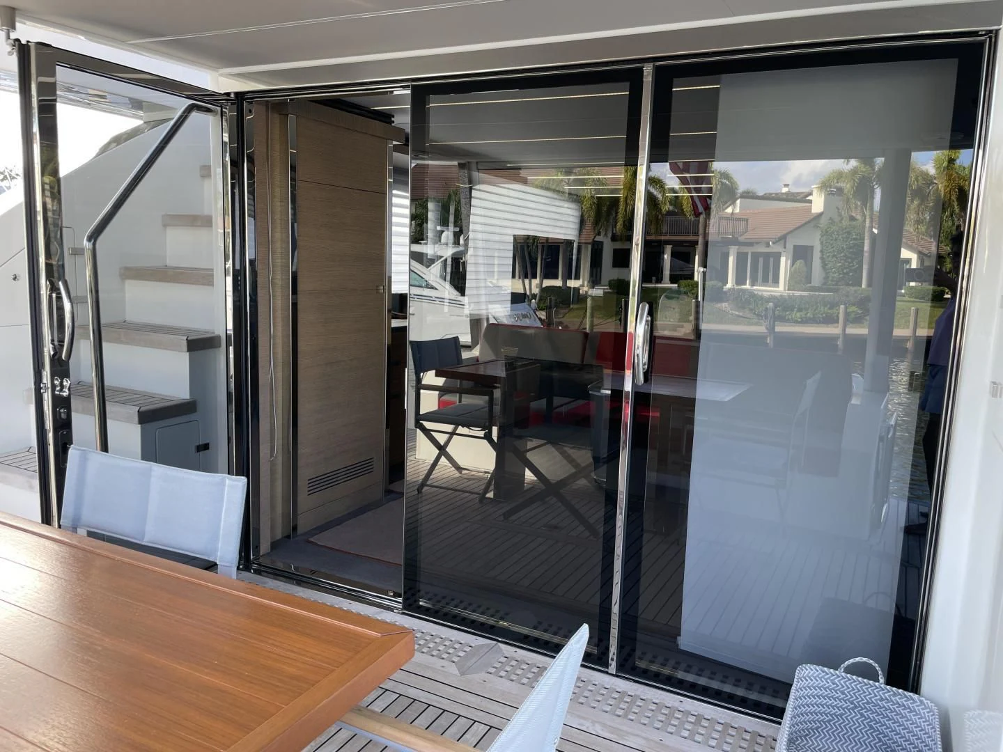 a room with glass doors aboard LEBRADA Yacht for Sale