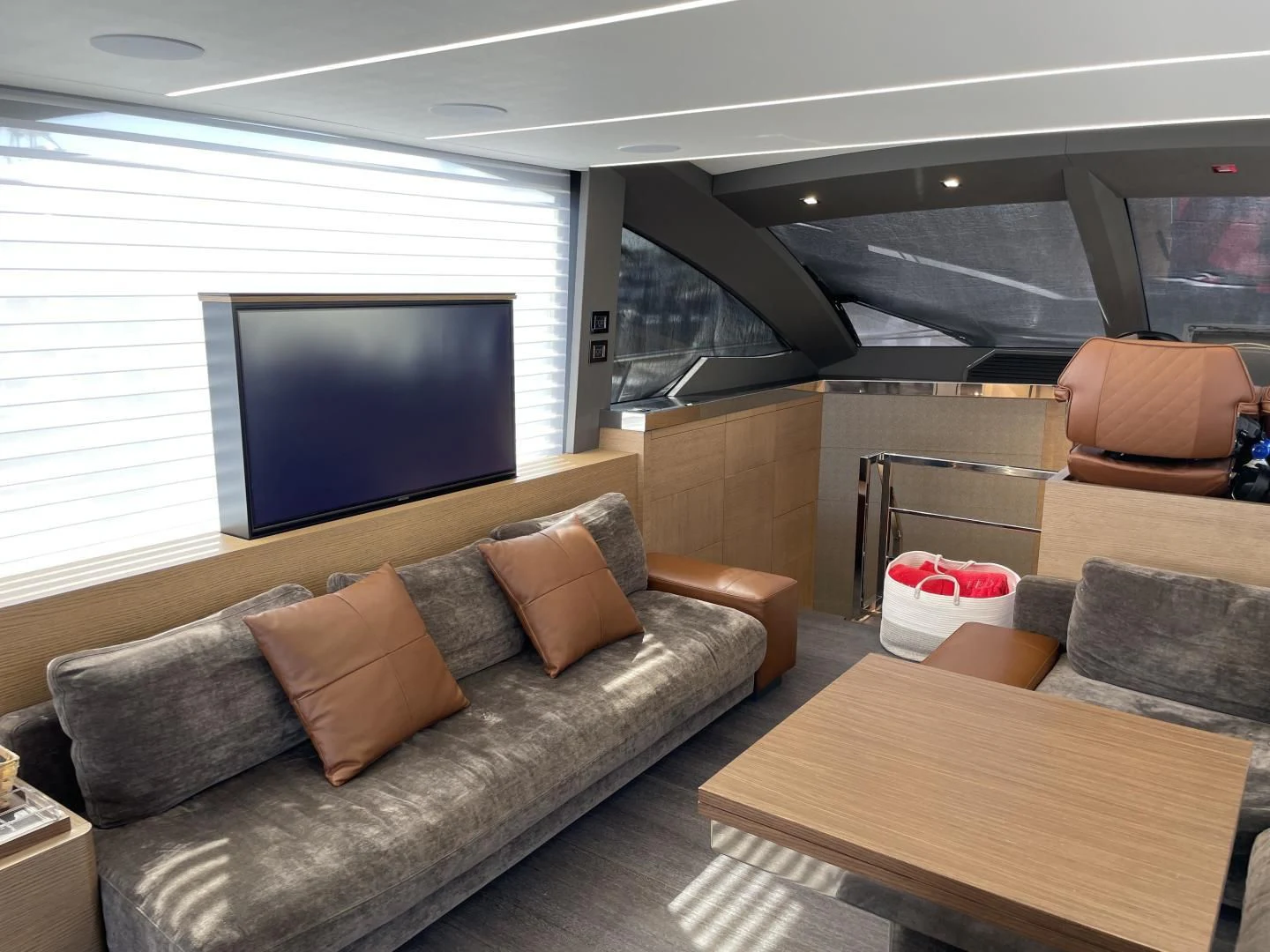 a living room with a large screen aboard LEBRADA Yacht for Sale