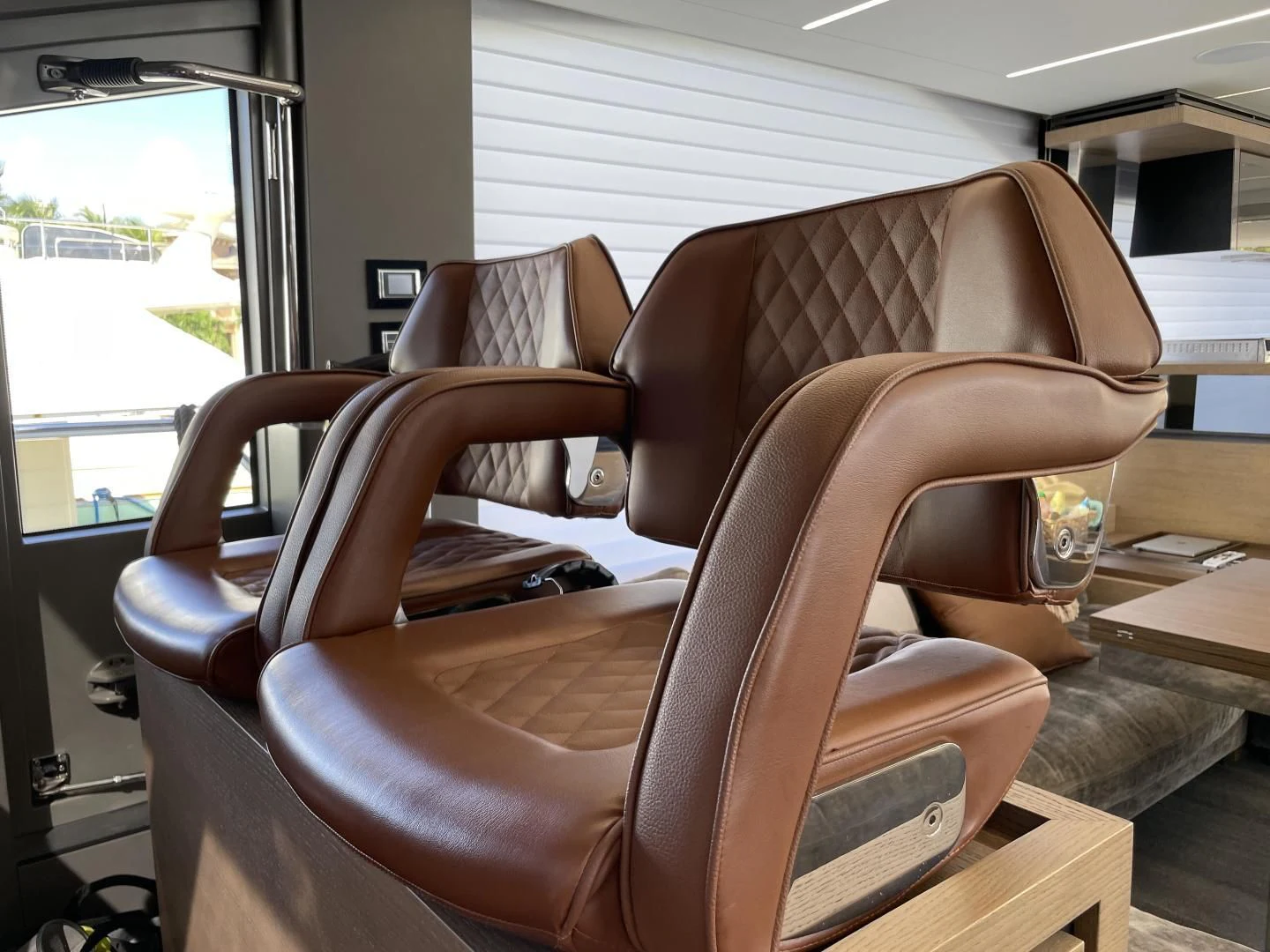 a couple of chairs in a room aboard LEBRADA Yacht for Sale