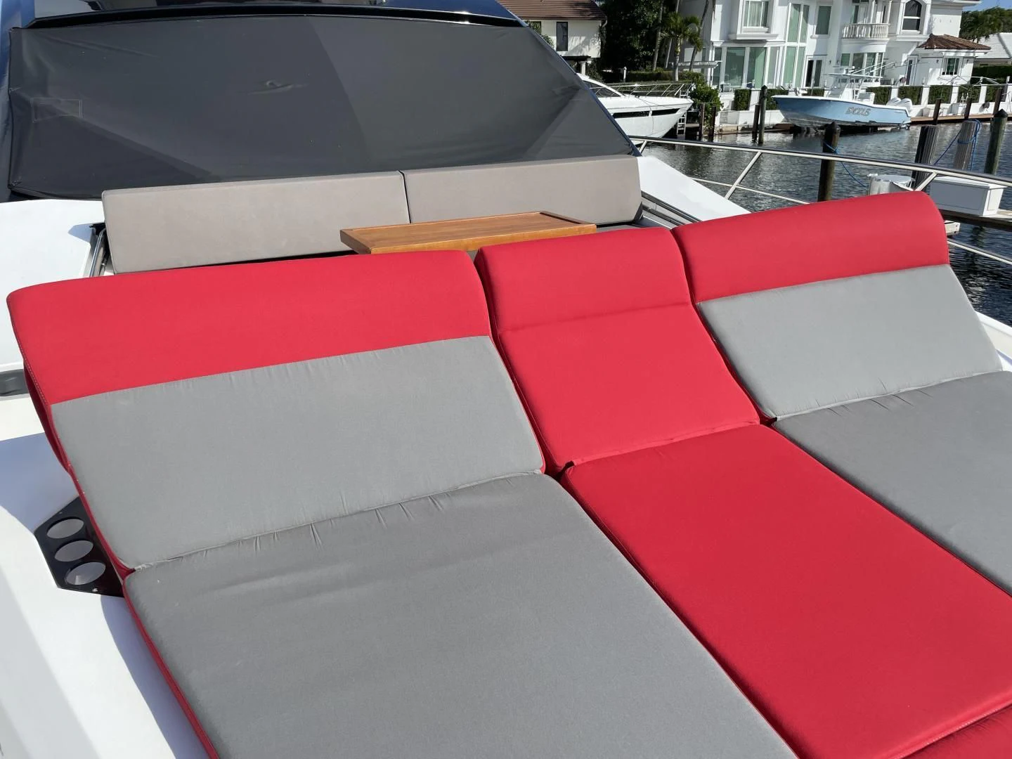 a red and white umbrella on a patio aboard LEBRADA Yacht for Sale