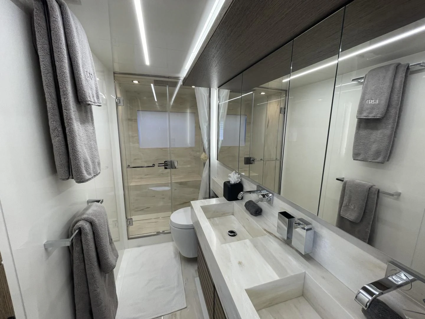 a bathroom with a large mirror aboard LEBRADA Yacht for Sale