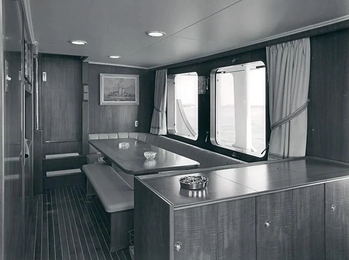 a kitchen with a bar and a bar aboard TARTAR Yacht for Sale