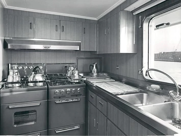 a kitchen with stainless steel appliances aboard TARTAR Yacht for Sale