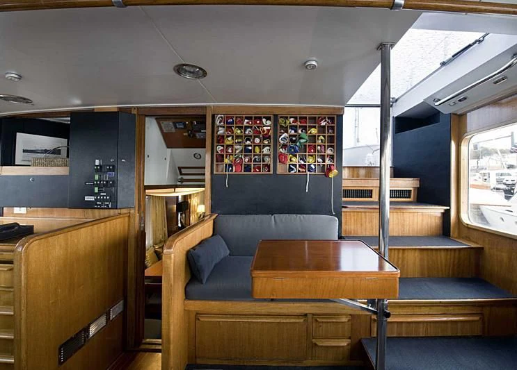 a room with a couch and a table aboard TARTAR Yacht for Sale