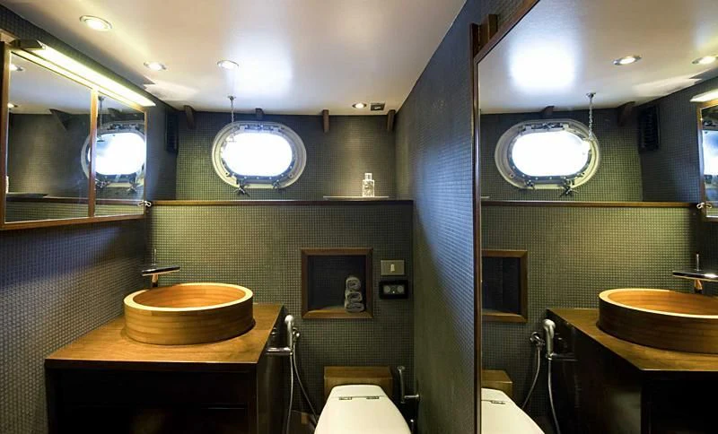 a bathroom with sinks and mirrors aboard TARTAR Yacht for Sale
