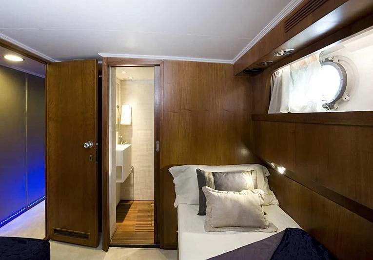 a bed in a room aboard TARTAR Yacht for Sale