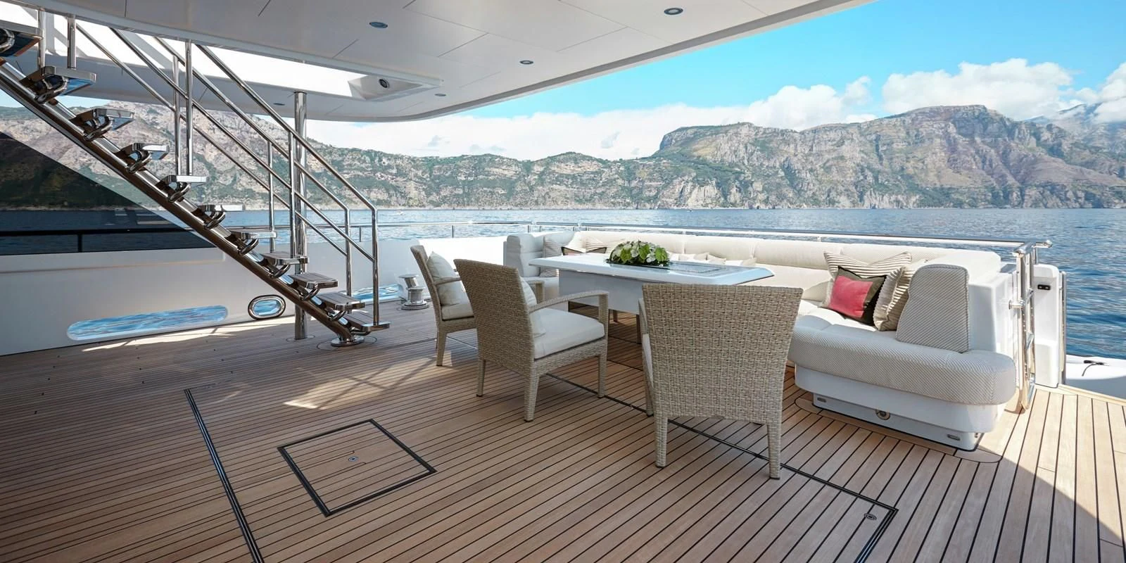 a deck with a table and chairs aboard PHILOSOPHY Yacht for Sale