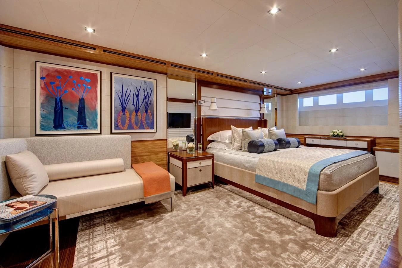 a bedroom with a bed and a couch aboard PHILOSOPHY Yacht for Sale