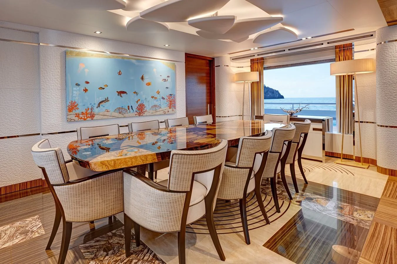a room with tables and chairs aboard PHILOSOPHY Yacht for Sale