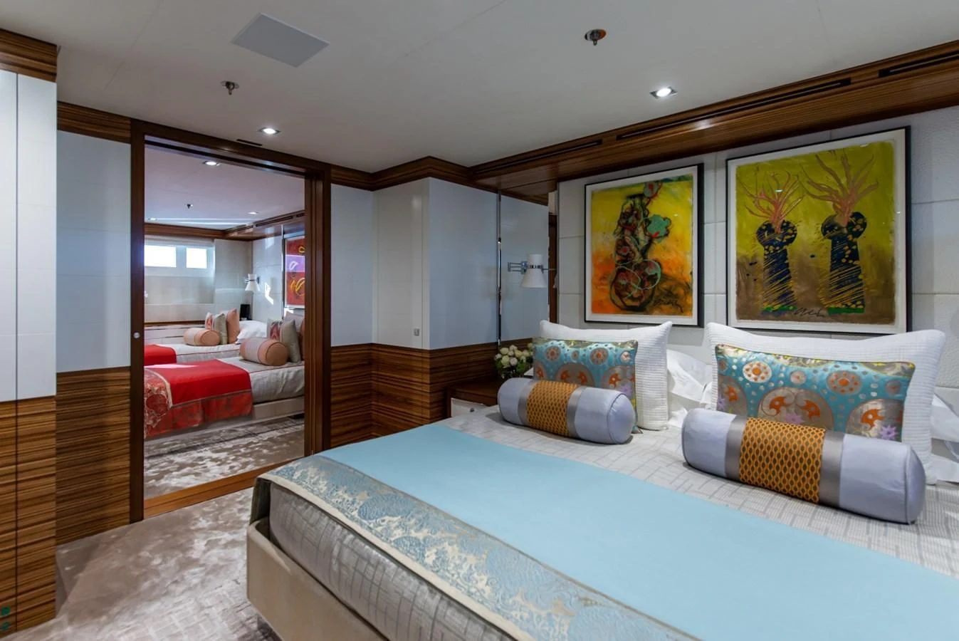 a bedroom with a bed and a couch aboard PHILOSOPHY Yacht for Sale