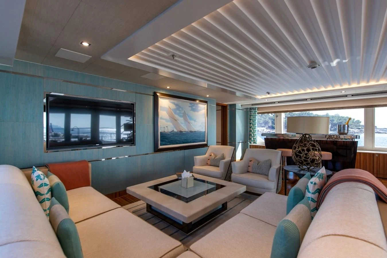 a living room with a large screen aboard PHILOSOPHY Yacht for Sale