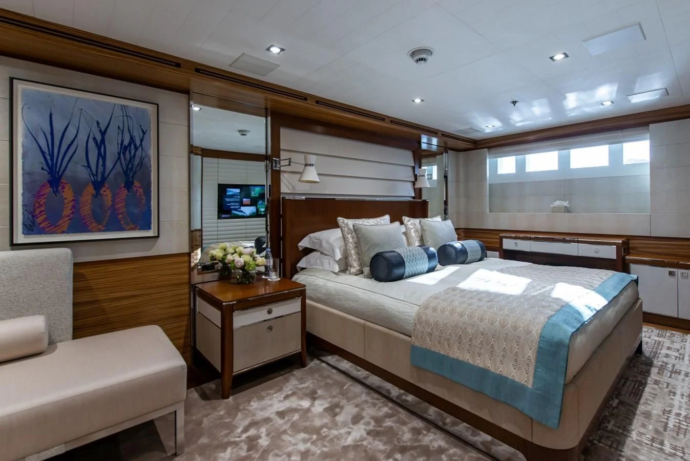 a bedroom with a bed and a couch aboard PHILOSOPHY Yacht for Sale