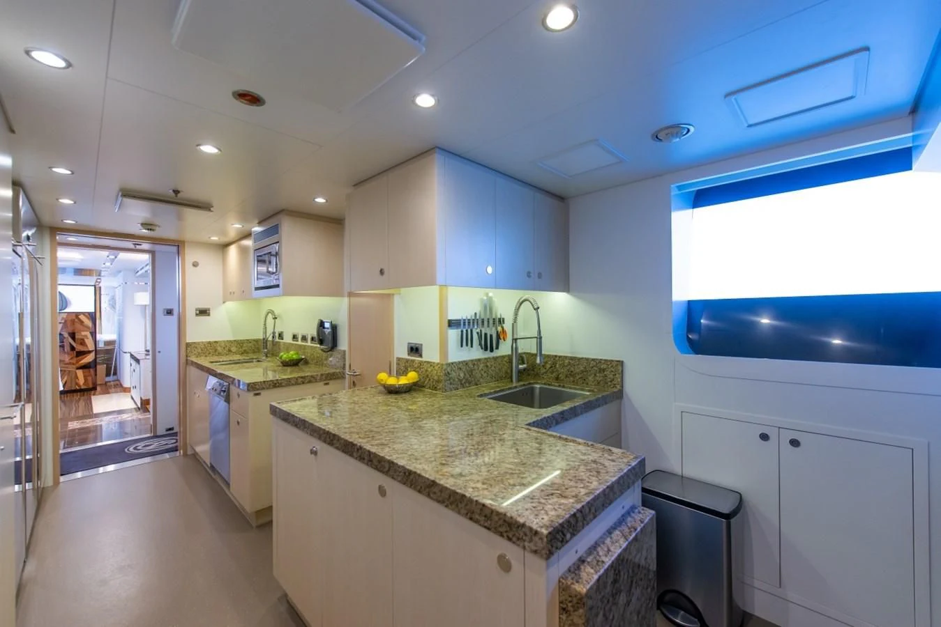 a kitchen with a marble counter top aboard PHILOSOPHY Yacht for Sale