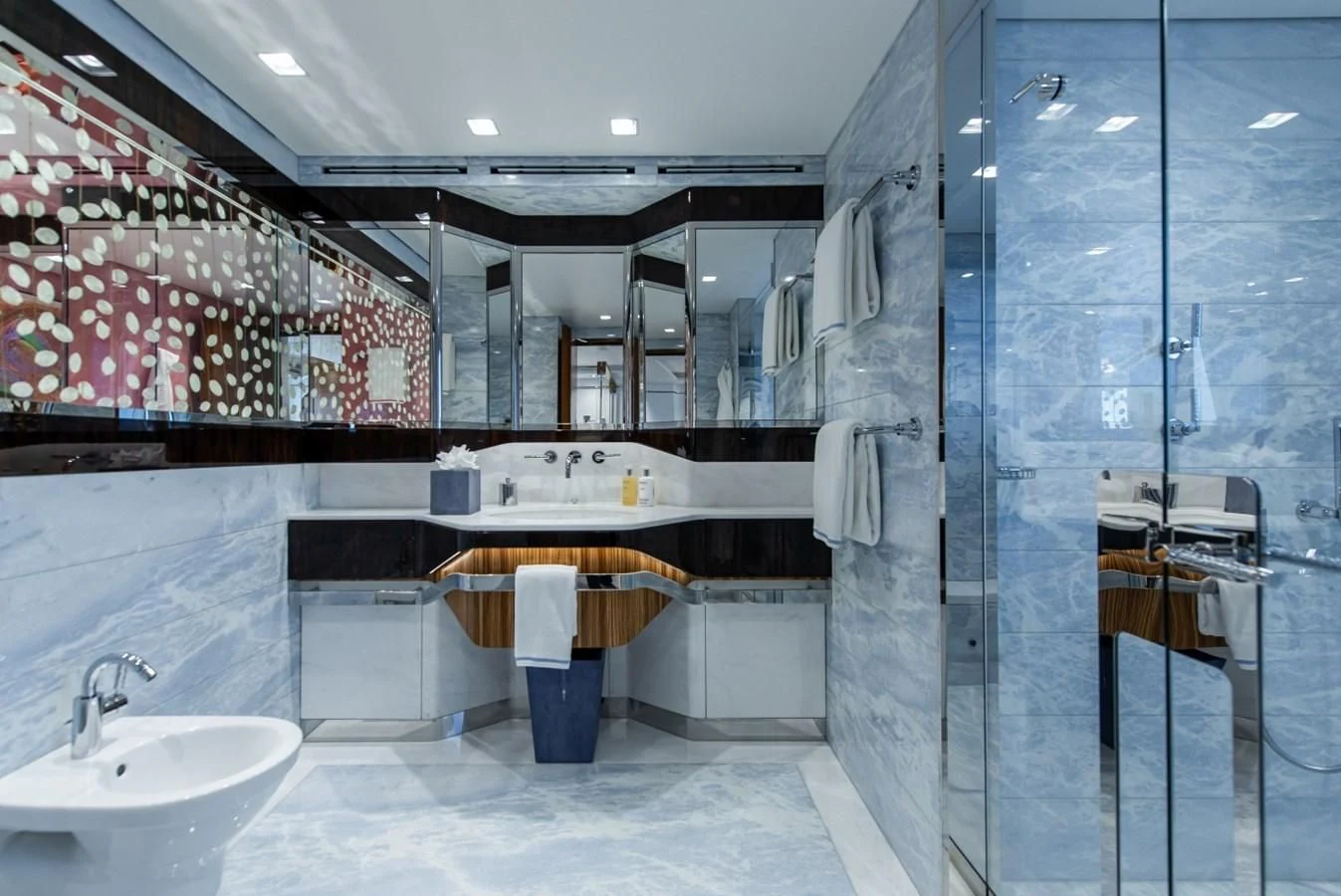 a bathroom with a glass shower aboard PHILOSOPHY Yacht for Sale