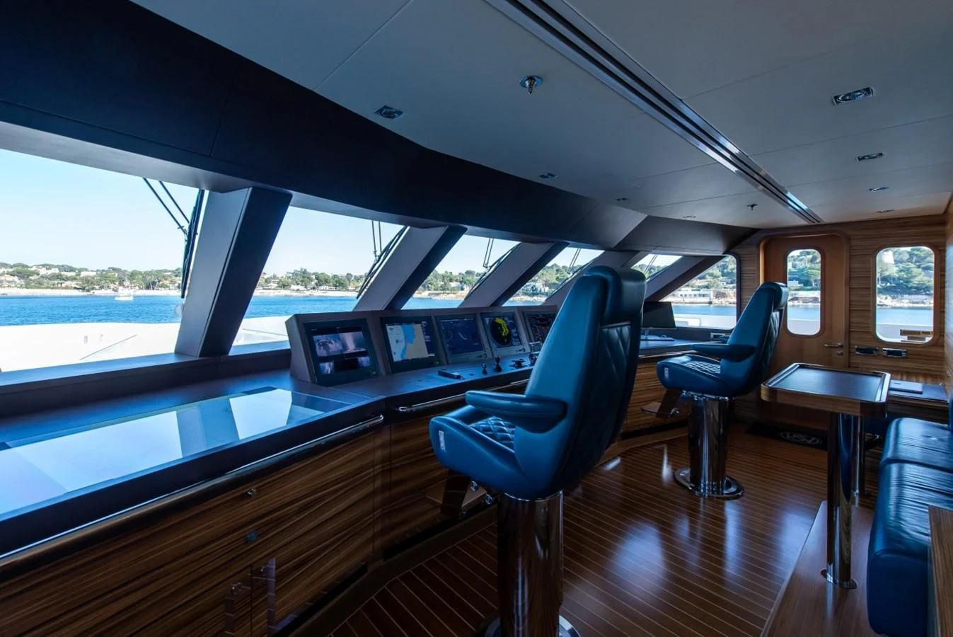 a room with a table and chairs aboard PHILOSOPHY Yacht for Sale