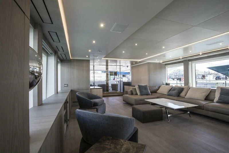a living room with a large window aboard ASIA POSEIDON Yacht for Sale
