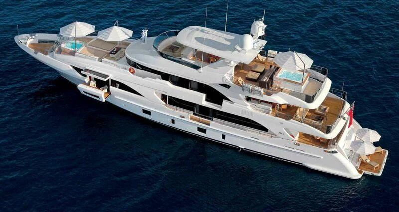 a white yacht on the water aboard ASIA POSEIDON Yacht for Sale
