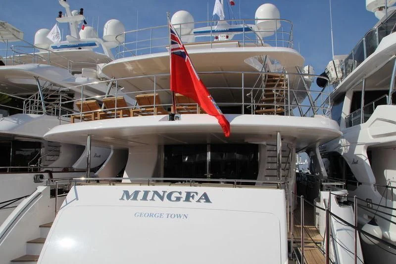 a boat with a flag on the front aboard ASIA POSEIDON Yacht for Sale