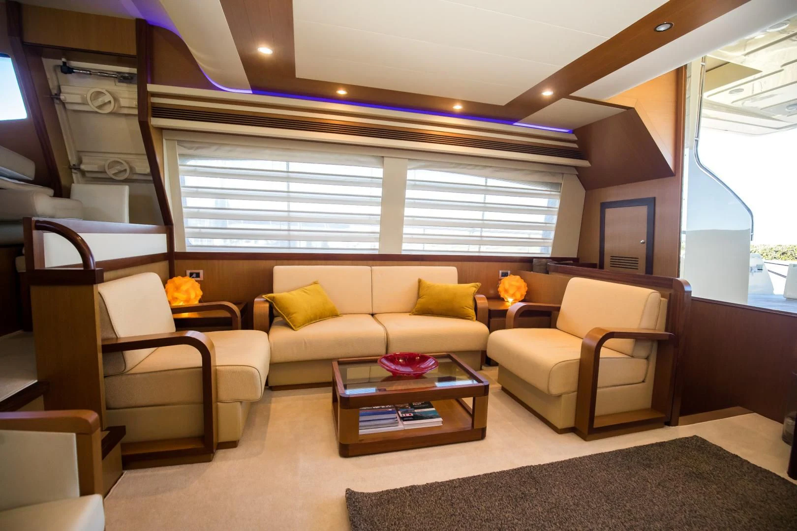 a living room with a couch and a coffee table aboard TESA Yacht for Sale