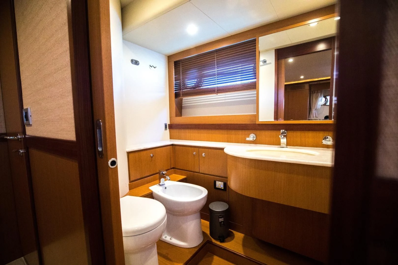 a bathroom with a toilet and a sink aboard TESA Yacht for Sale