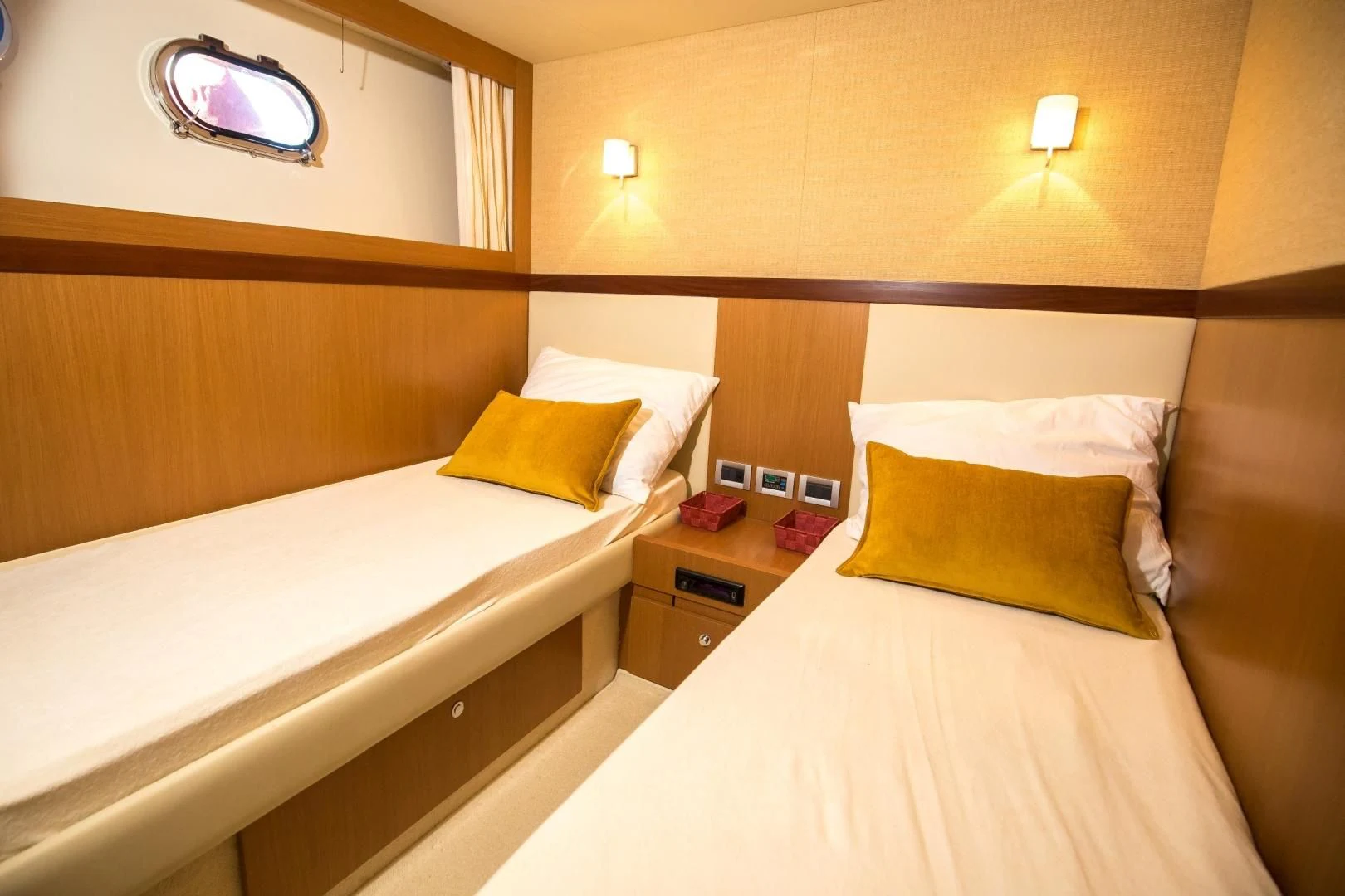 a room with two beds aboard TESA Yacht for Sale