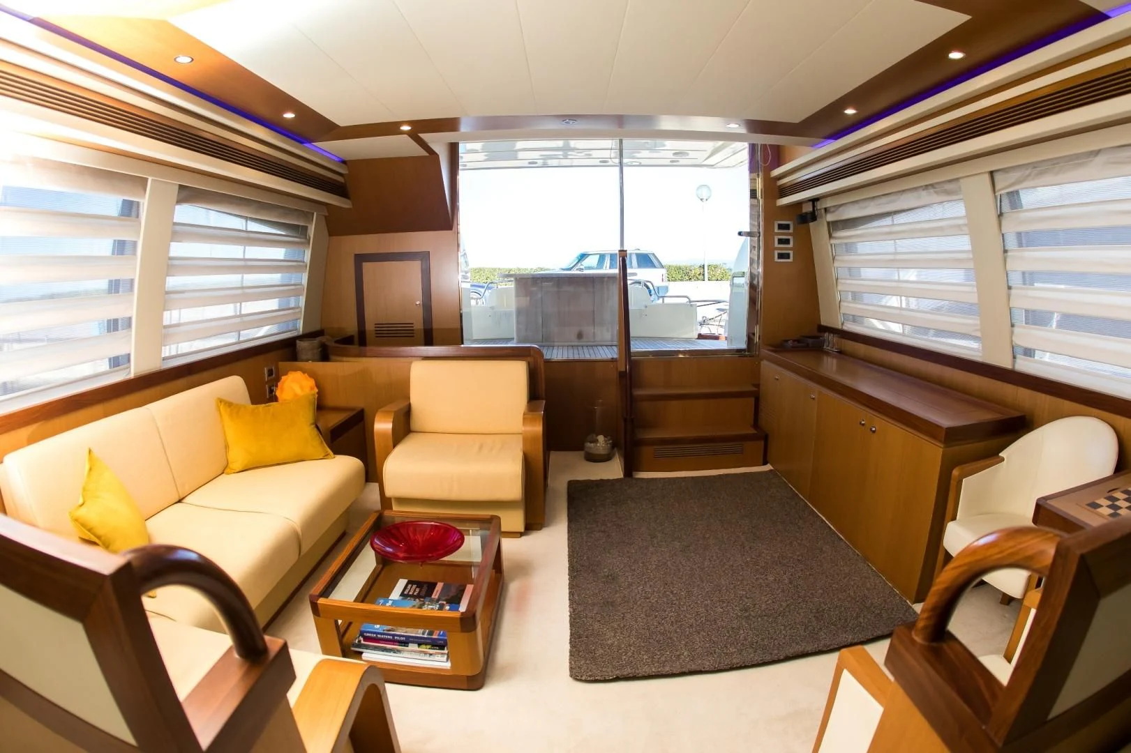 a living room with a couch and a coffee table aboard TESA Yacht for Sale