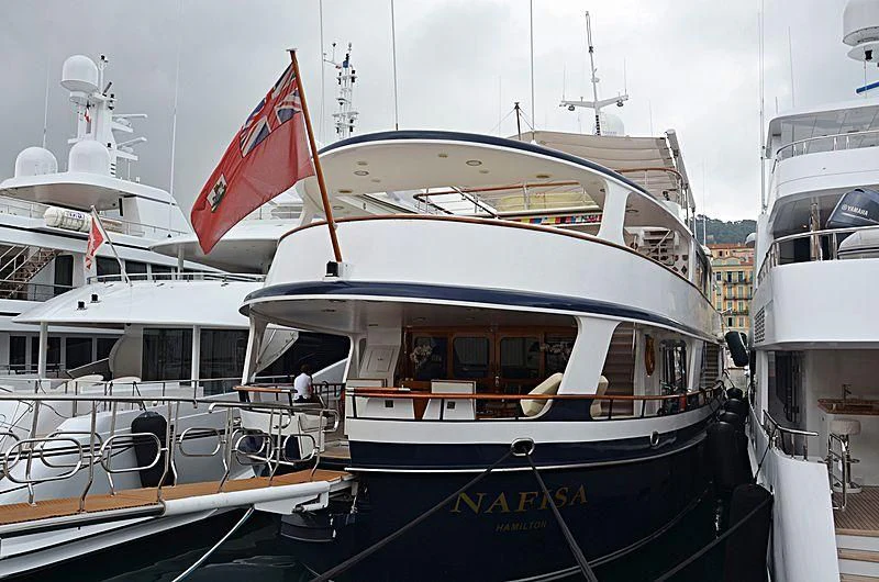 a boat with flags on it aboard NAFISA Yacht for Sale
