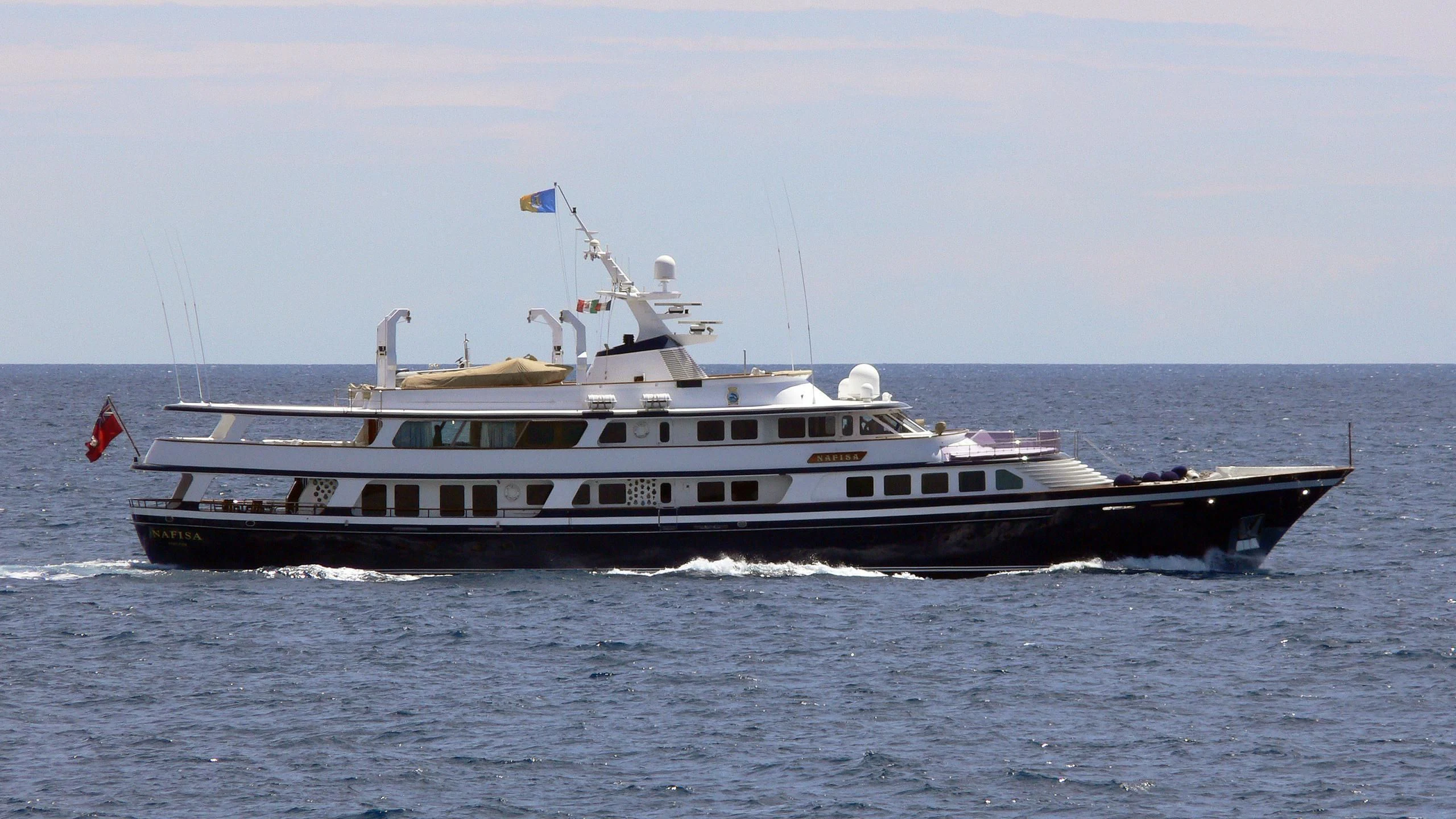 a large ship on the water aboard NAFISA Yacht for Sale