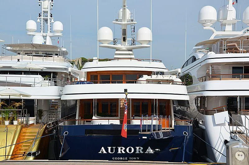 a large boat docked at a pier aboard AURORA Yacht for Sale