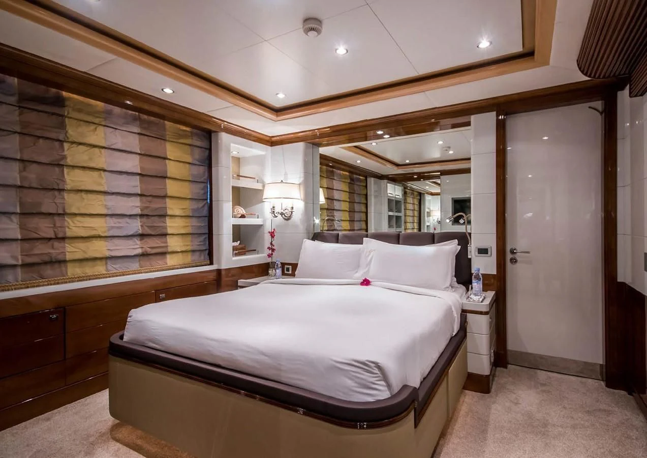 a large bedroom with a large bed aboard DIANE Yacht for Charter