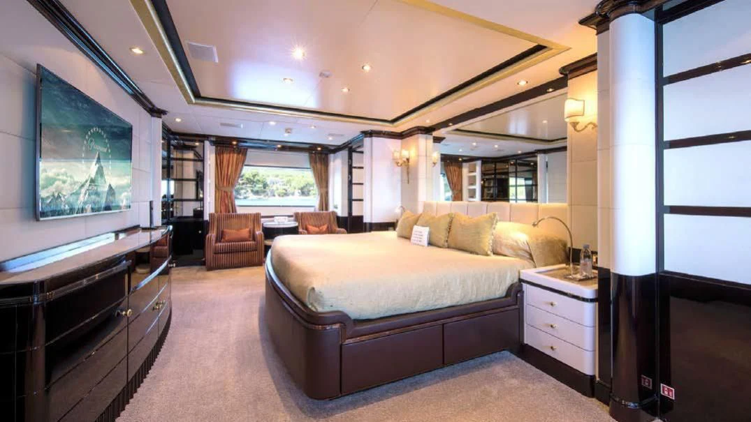 a large bedroom with a large bed aboard DIANE Yacht for Charter
