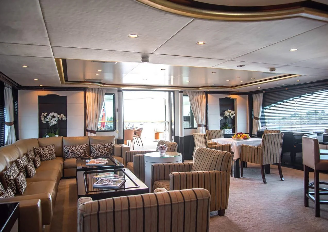 a living room with a couch and a table aboard DIANE Yacht for Charter