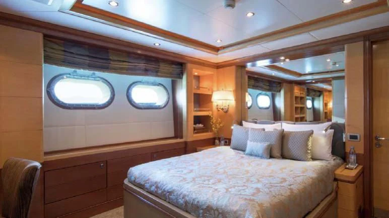 a room with a bed and a window aboard DIANE Yacht for Charter