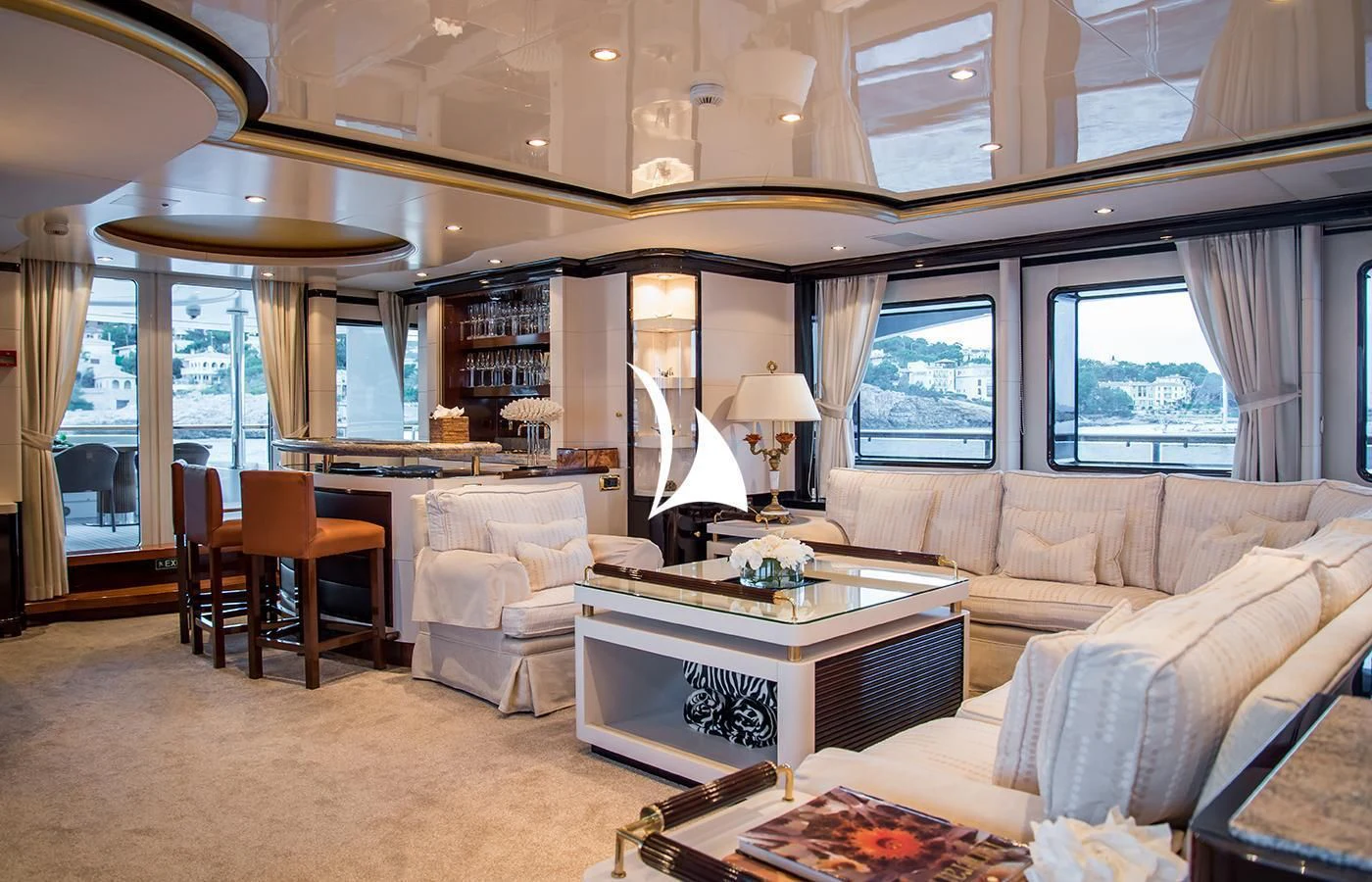 a living room with a large window aboard DIANE Yacht for Charter