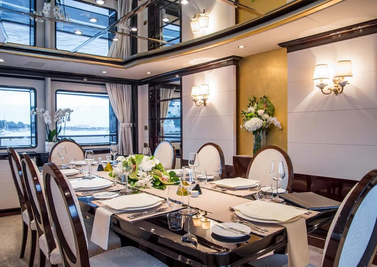 a dining room with a table set aboard DIANE Yacht for Charter