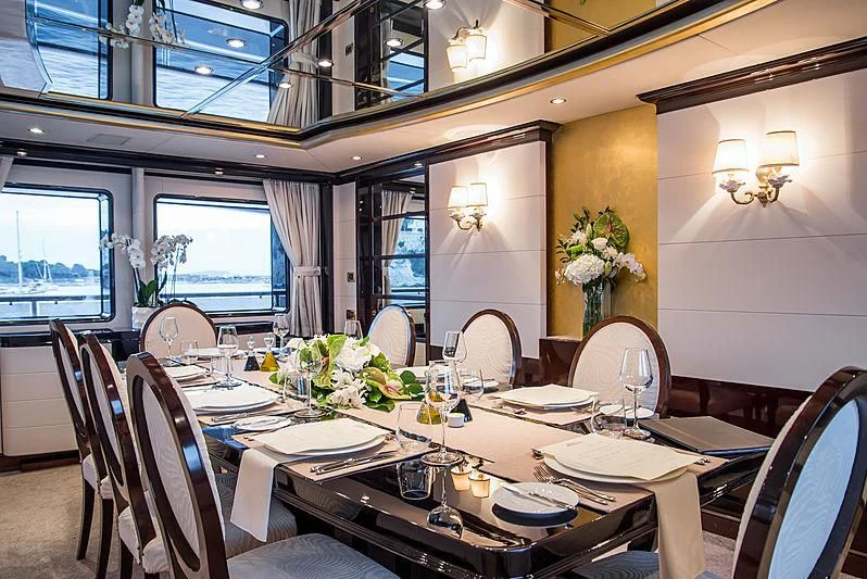 a dining room with a table set aboard DIANE Yacht for Charter