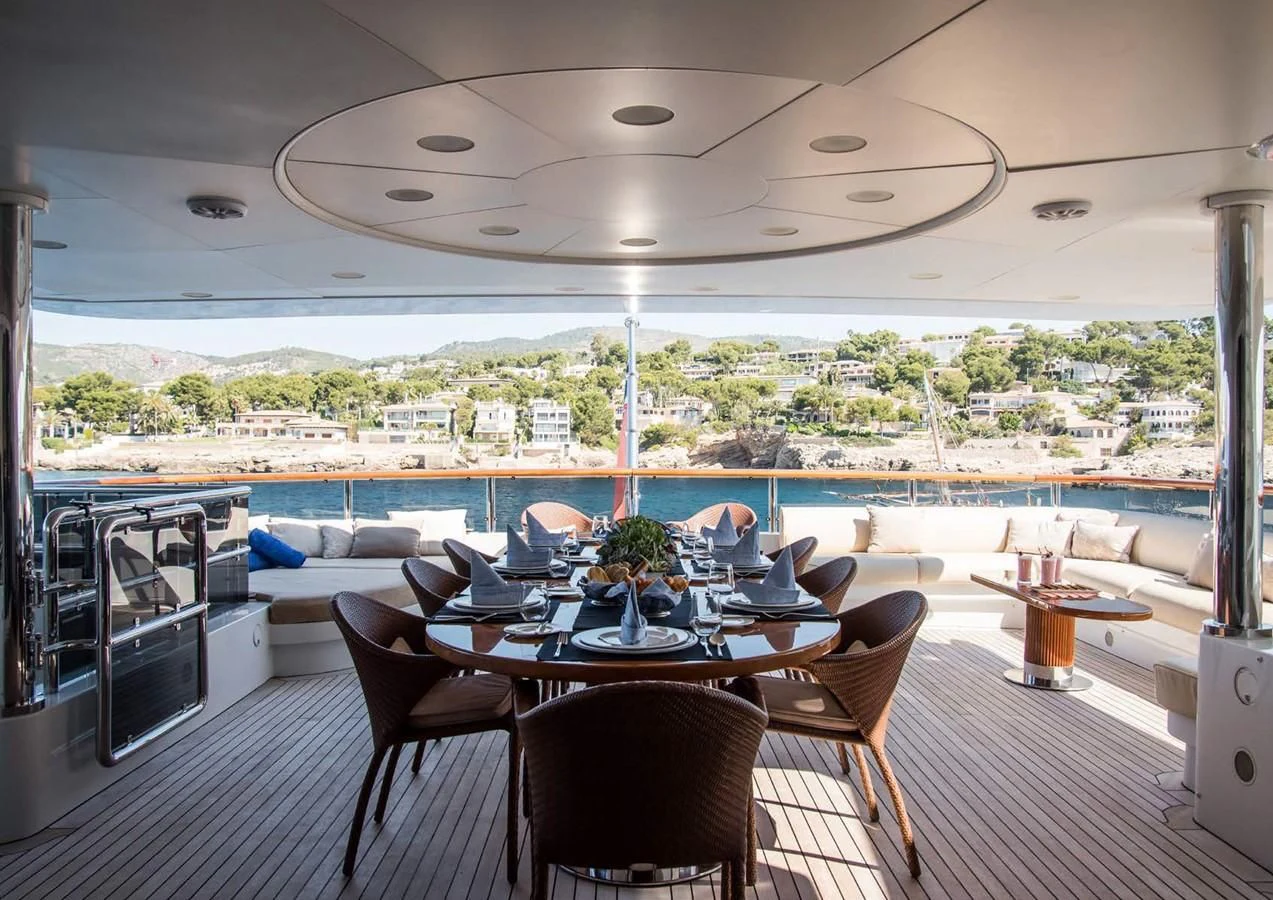 a large room with a table and chairs aboard DIANE Yacht for Charter