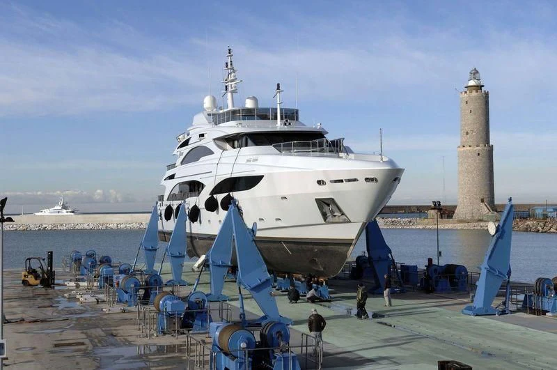 a large white boat docked aboard DIANE Yacht for Charter