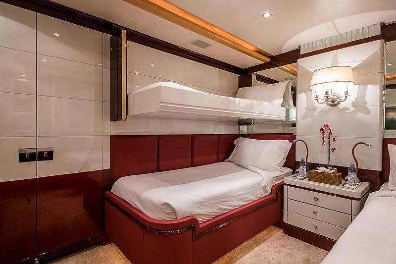 a bedroom with a bed and a shower aboard DIANE Yacht for Charter