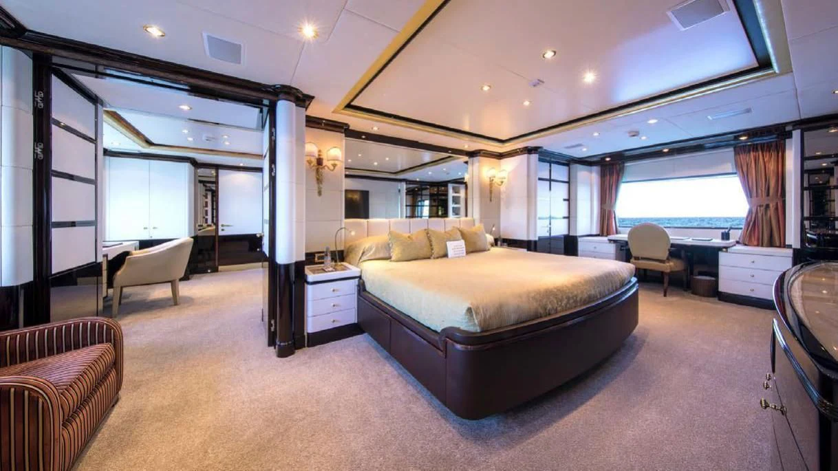 a large bedroom with a large bed aboard DIANE Yacht for Charter